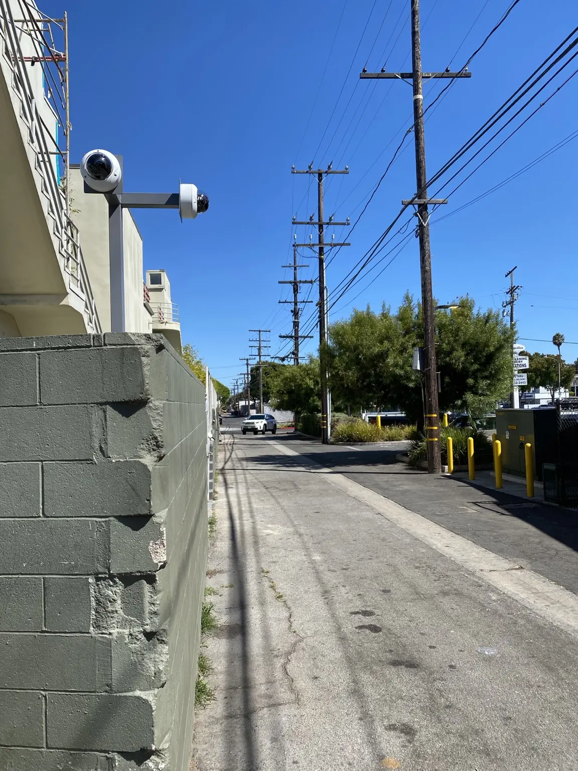 Complete multi-directional commercial camera post positioned for after-hours verification — Three Factor Security fieldwork in Santa Monica