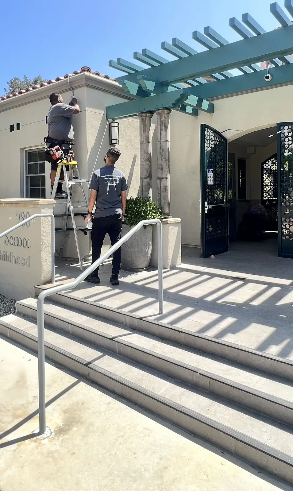 Exterior coverage installed around an active campus entrance — Three Factor Security fieldwork in Pasadena