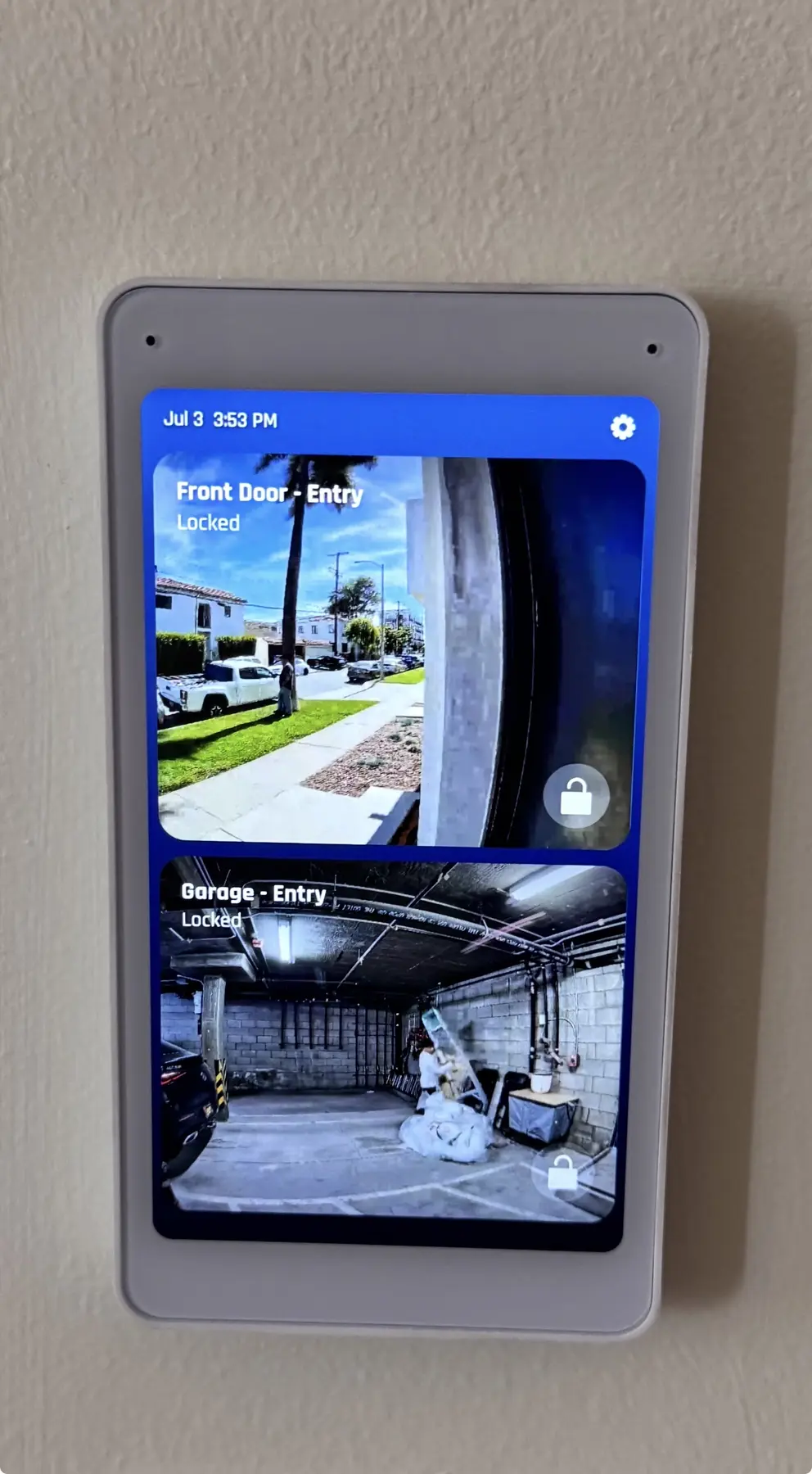Wall-mounted entry-control interface showing managed front-door and garage access — Three Factor Security fieldwork in Los Angeles, California
